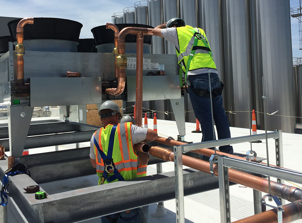 RMS Pros employees hard at work on a commercial refrigeration system